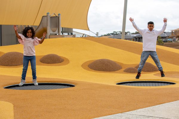 Two children jumping