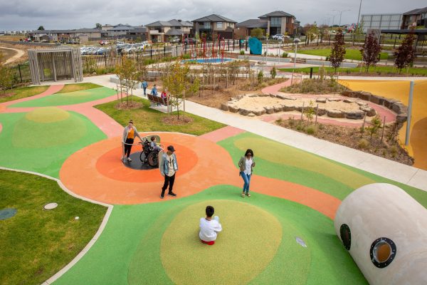 A view of playground with parents and children