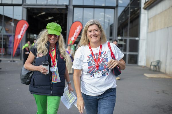 Two ladies walking towards camera