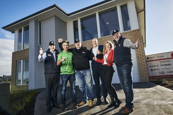 Variety Home Auction team standing infront of Rockbank house with thumbs up