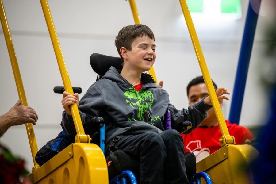 Boy in wheelchair joyfully experiences the Variety Liberty Swing